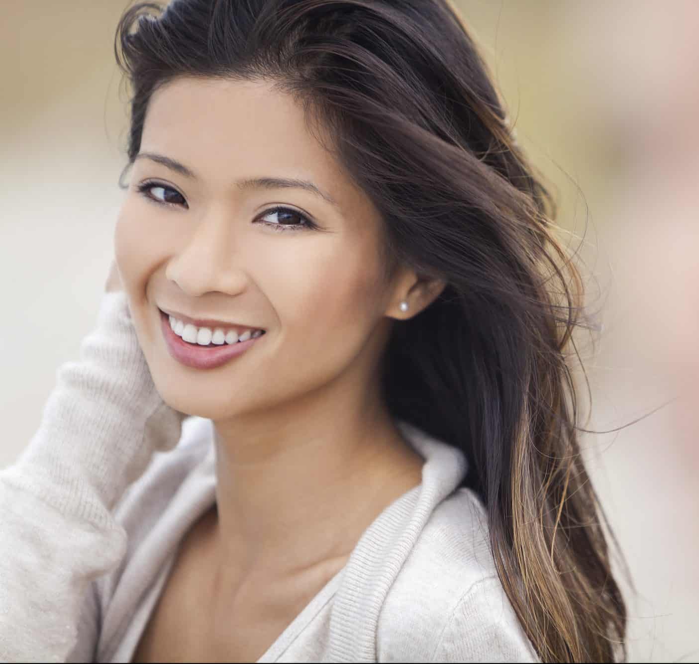An Asian woman smiling 