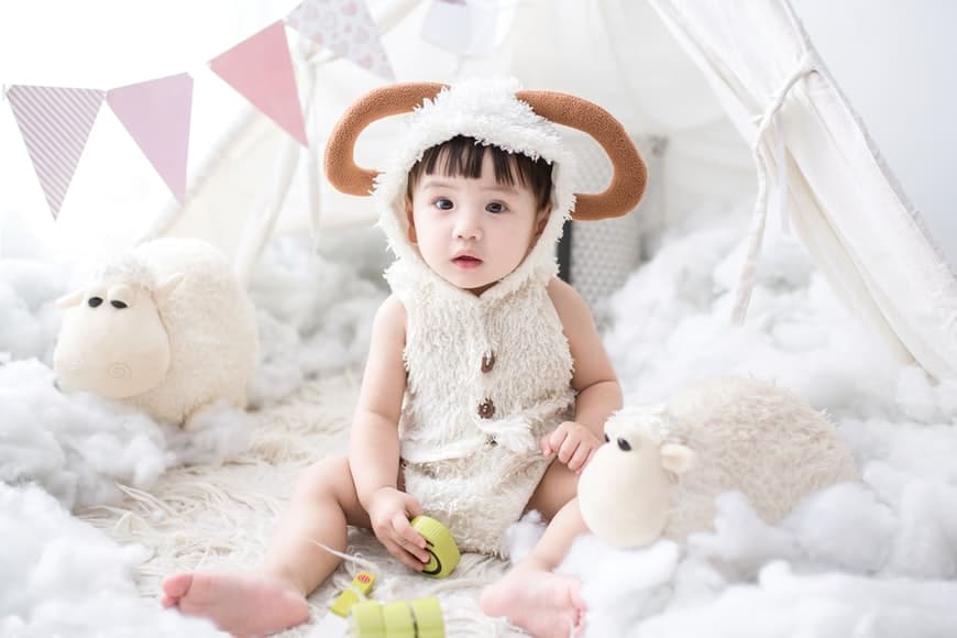 young asian baby in a photoshoot dressed up 
